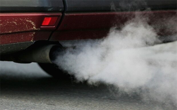 A vehicle's exhaust pipe releases fumes