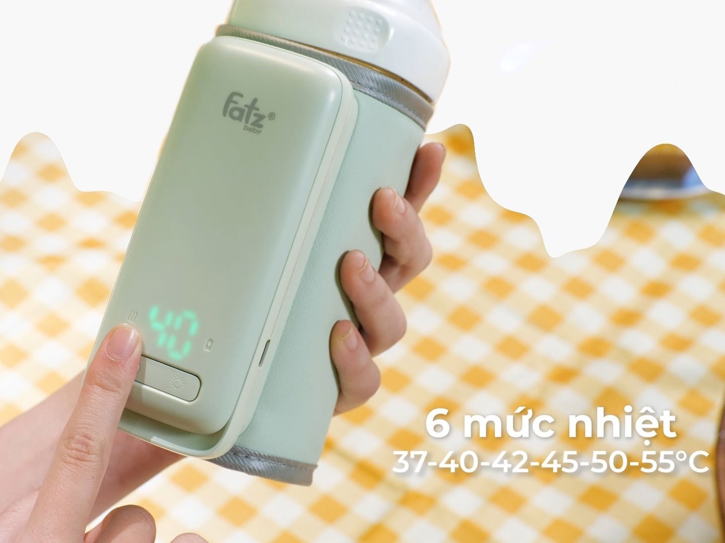 Dụng cụ hâm sữa cầm tay