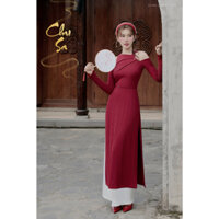 Áo dài CHU SA - Chất liệu: Vải thun tăm đỏ đô - Phom dáng: Áo ôm dài, Cổ xếp ly lệch, khoét vai, tay dài