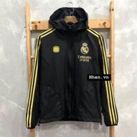 ÁO KHOÁC GIÓ REAL MADRID ĐEN SỌC VÀNG DÀI 2023/24