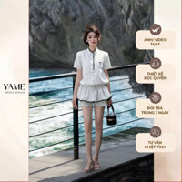 Bộ liền jumpsuit hoạ tiết kẻ dáng quần giả váy xoè cổ đứng viền ren ốp túi nơ ngực YAME YV404