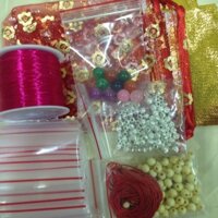 Combo 100hat dâu + 10( bi bạc, tui zip, đá, túi lộc, cước lụa, dây dù)