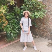 Đầm trắng chấm bi thắt nơ ở sau lưng