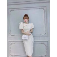 Đầm trăng vai nơ