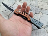 Dao bấm hình súng vàng