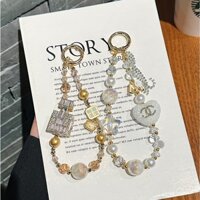 Dây chuyền đính cườm phong cách Chanel cao cấp Thời trang phù hợp Đơn giản Sáng tạo độc đáo Thích hợp cho mọi loại điện thoại di động / túi Chìa khóa treo phong cách năm mới
