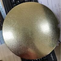 Đế lót bánh giấy tròn vàng cán vân 29cm