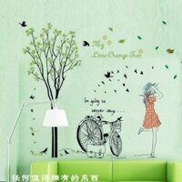 DECAL DÁN TƯỜNG CÂY XANH VÀ CÔ GÁI XE ĐẠP