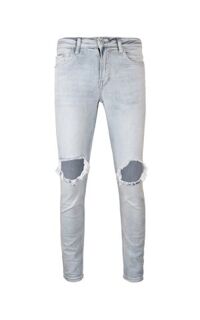 Distressed Skinny Jeans In Mid Wash Blue