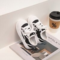 Giày bánh xốp màu đen vải bố mẫu mới 2025 Giày Bánh quy kiểu Chanel mẫu xuân thu đế dày bé gái giày đơn 1-3 tuổi