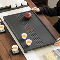 khay trà bằng đá Toàn bộ một mảnh vàng đen sứ đá khay trà Trung Quốc hiện đại đơn giản nhà phòng khách lớn để bàn bàn trà trà trà biển khay trà bằng đá khay trà bằng đá