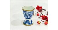 Ly sứ uống rượu men lam giả cổ vẽ long ẩn bọc đồng LS01