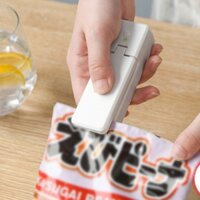 Máy hàn miệng túi nhỏ cầm tay gia đình màu trắng Máy ép tay cầm tay