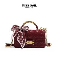 MG6992-1. Túi xách nữ MISS GAIL thương hiệu HongKong thiết kế ô trần trám kèm nơ sang trọng, thanh lịch.