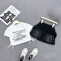 Ong Kis Sét áo phông cổ V in loang chữ kèm chân váy Jane nơ đính ngọc cho bé gái 10-30kg