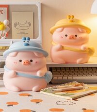 Ống Tiết Kiệm Heo Đất Hoạt Hình Đội Nón Vịt Đeo Túi