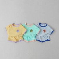 Phiên Bản Hàn Quốc Phong Cách Hàn Quốc Quần Áo Trẻ Em Vách Ngăn Cổ Tròn Hoạt Hình Cạnh Mùa Hè Phù Hợp Với Thời Trang Màu Kẹo Quần Short Tay Ngắn