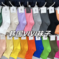 Phong cách mới Hàn Quốc Dongdaemun Bán buôn tất cotton màu kẹo cuộn cạnh giữa bắp chân Tất nữ màu đồng nhất Tất đơn giản