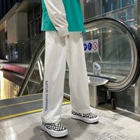 Quần jogger unisex nam nữ A99 quần dài ống rộng thêu chữ ở gấu 2 màu đen trắng phong cách Hàn Quốc cá tính.