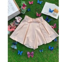 quần váy màu be nơ nhỏ