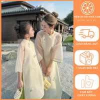 Set áo dài mẹ và bé mới nhất 2024 - vải tơ - họa tiết đính kết và thêu cao cấp - màu kem - áo dài Nhà Cam - ND01