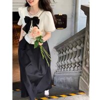 Set áo phối viền nơ ngực và chân váy xòe