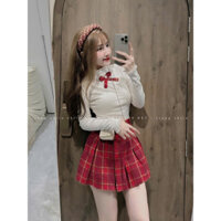 Set bộ thiết kế thời trang nữ chất áo tăm lạnh cổ lọ đính nơ ngực tay dài kèm chân váy nỉ dáng ngắn mini