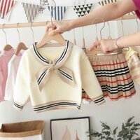 Sét váy len . Màu trắng. Chân váy burberry. Len mềm mịn lắn luôn nhé.