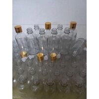 Sỉ 50 vỏ chai thủy tinh 50ml , trong. Nắp hoen vàng vặn + nhỏ giọt.