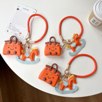 Thích hợp cho Apple AirPods 1 / 2 Pro 3 Pro2 4 Vỏ bảo vệ tai nghe Vỏ bảo vệ túi màu cam + Mặt dây chuyền