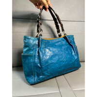 Túi si da bò thật màu xanh lông công, dập hoa như hình