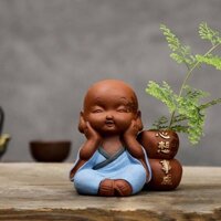 tượng chú tiểu trồng cây an khang