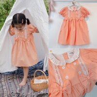 Váy bé gái, đầm Liebe màu cam cổ bèo phối nơ xinh xắn chất thô boi mềm mát phù hợp cho bé đi học đi chơi Bắp Ngô Kids