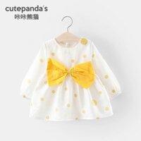 Váy xoè nơ vàng chấm bi