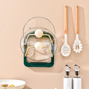 Dụng cụ đỡ nắp vung nồi